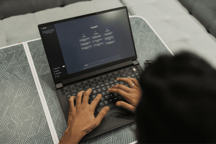 hands typing , screen displaying chat gpt